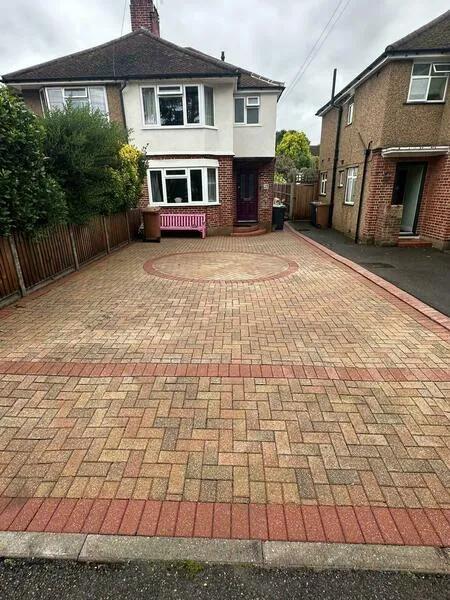 A block paved driveway in front of a semi detached house